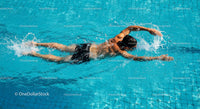 Male Swimmer Freestyle in Turquoise Pool