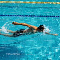 Swimmer in Freestyle Stroke at Sunny Pool