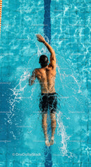 Athletic Man Freestyle Swimming in Blue Pool