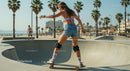 Young Woman Skateboarding at Sunny Beach Skate Park