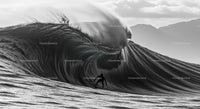 Surfer Riding Massive Ocean Wave in Scenic View