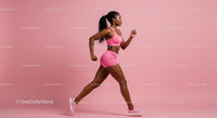Athletic Woman Running in Pink Sportswear Indoors