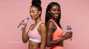 Active Women in Pink Sportswear Hydrating After Workout