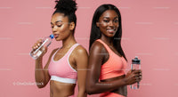 Active Women in Pink Sportswear Hydrating After Workout