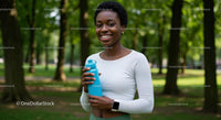 Smiling Woman Enjoying a Healthy Park Workout