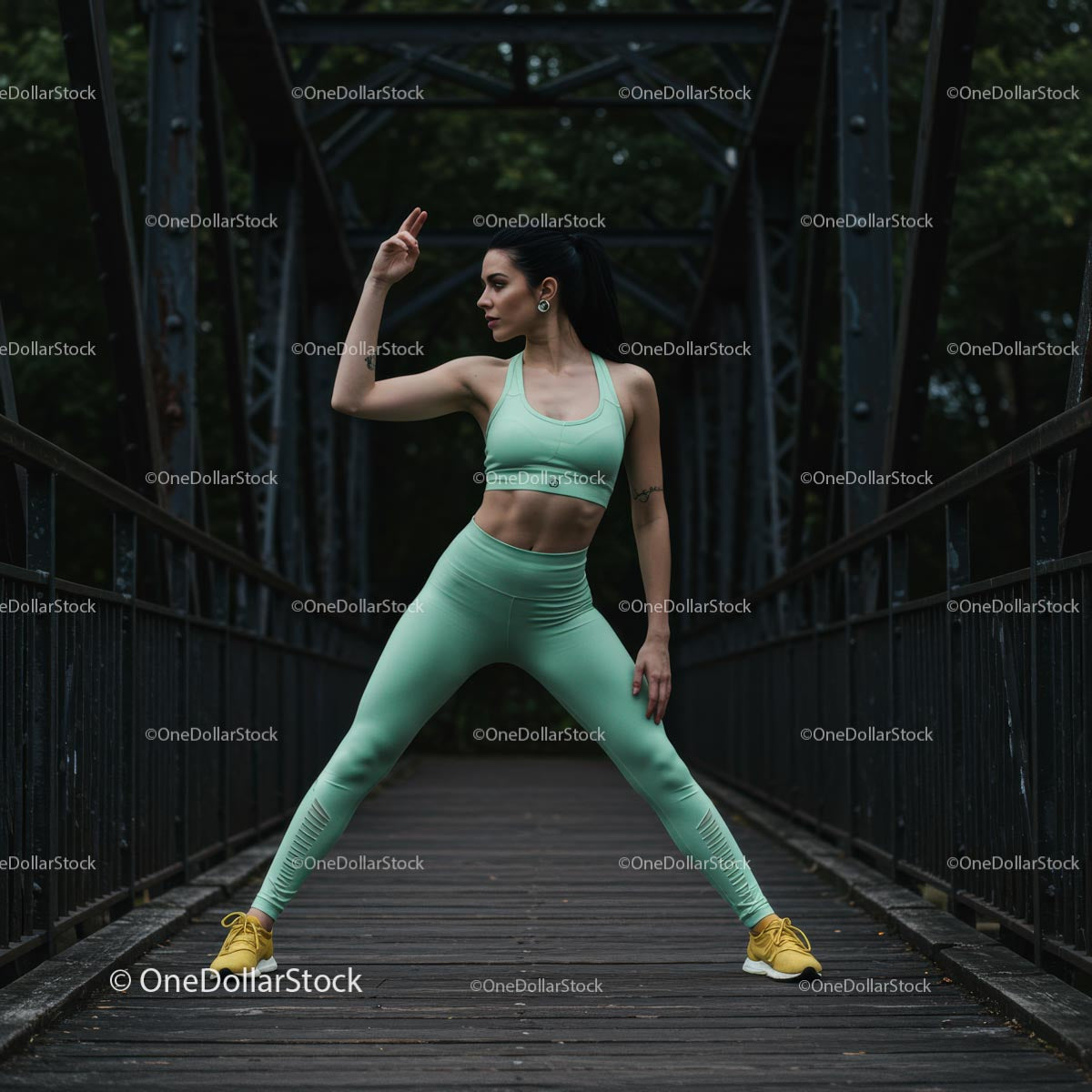 Fit Woman Stretching on an Old Bridge in Athletic Wear
