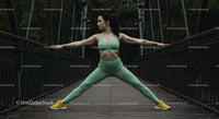 Woman Practicing Yoga on a Bridge in Nature