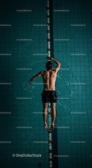 Athletic Man Swimming in Pool from Top View