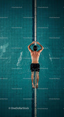 Male Swimmer in a Pool Performing Backstroke