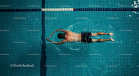 Top View of Man Swimming Freestyle in Blue Pool