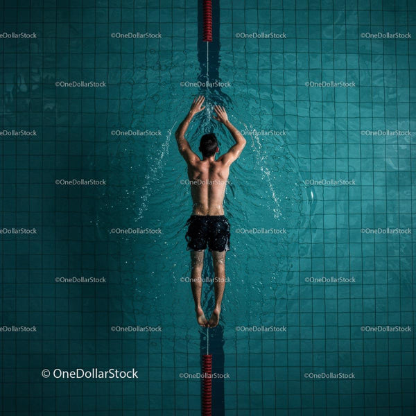 Athletic Male Swimmer in Dynamic Freestyle Stroke
