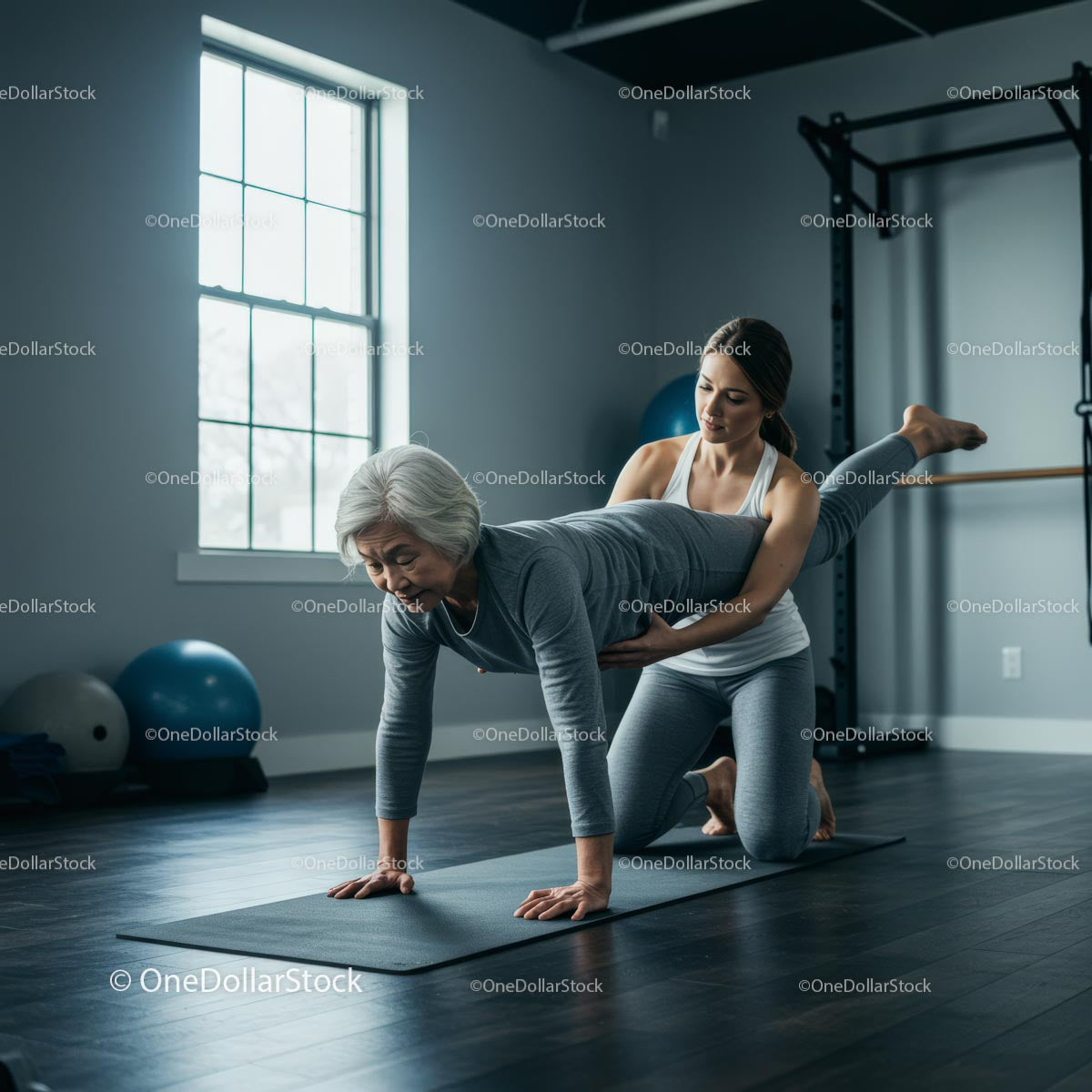 Senior Woman Practicing Yoga with Personal Trainer in Gym