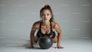 Focused Woman Exercising with Black Fitness Ball