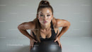 Determined Woman Exercising with a Stability Ball