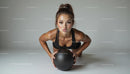Focused Fitness Woman with Medicine Ball on Workout Mat