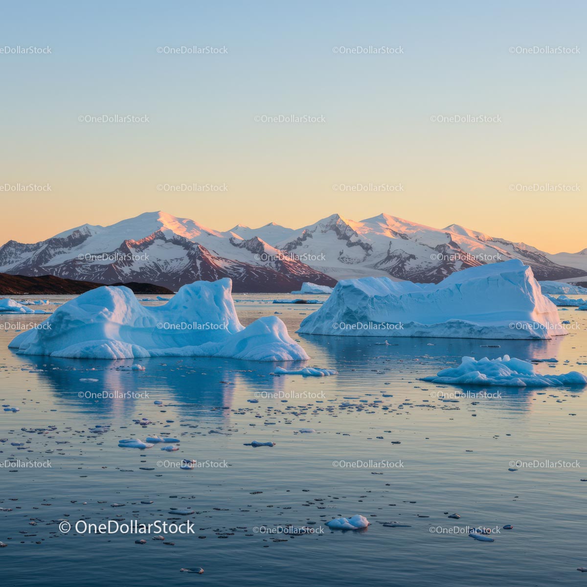 Majestic Icebergs and Snowy Mountains at Dawn