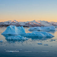 Icebergs and Majestic Mountains at Sunset