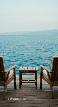 Tranquil Seaside Chairs on a Wooden Deck Overlooking Ocean