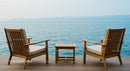 Serene Coastal Deck with Wooden Chairs Overlooking the Ocean