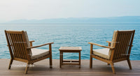 Serene Coastal Deck with Wooden Chairs Overlooking the Ocean