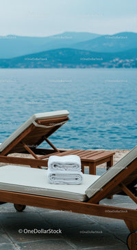 Oceanfront Lounge Chairs with Towels by the Sea