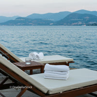 Luxurious Beachfront Loungers Overlooking Serene Sea