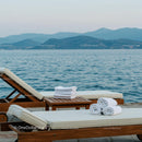 Elegant Sun Loungers by a Tranquil Ocean View