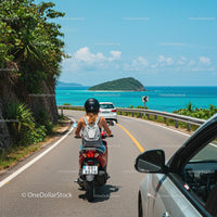 Motorcyclist Enjoying a Scenic Coastal Road Trip