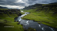 Majestic River Winding Through Lush Green Valley