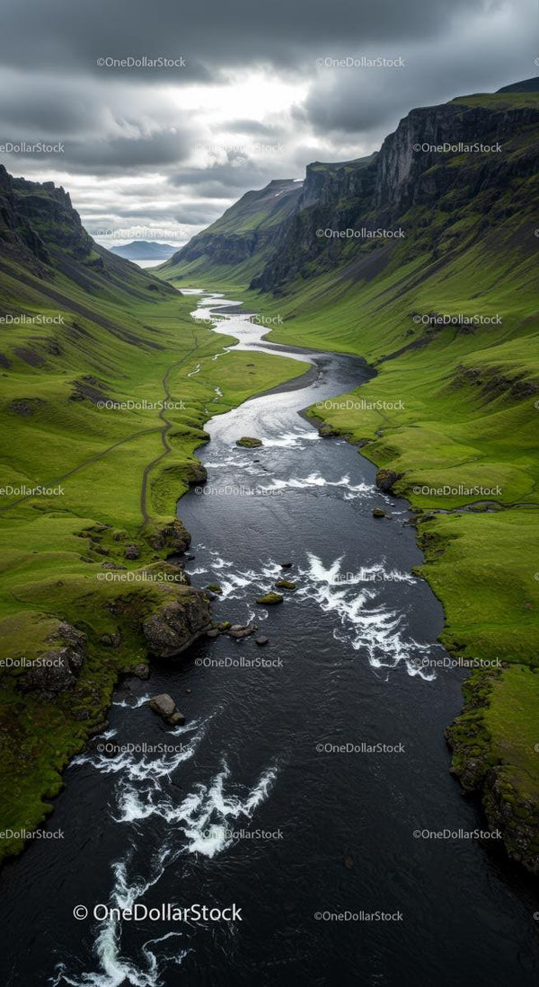 Winding River Through Dramatic Green Valley and Cliffs