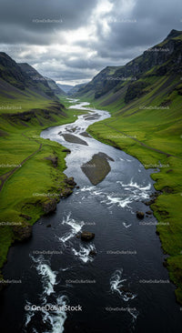 Winding River Through Verdant Valley Under Cloudy Skies