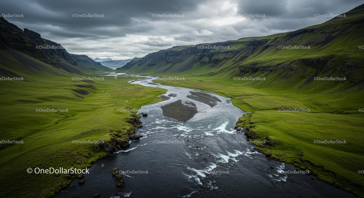 Dramatic Green Valley with Winding River and Cloudy Sky