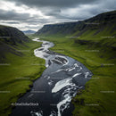 Aerial View of a Majestic River Through Green Valleys