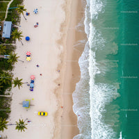 Aerial View of Tropical Beach with Colorful Umbrellas