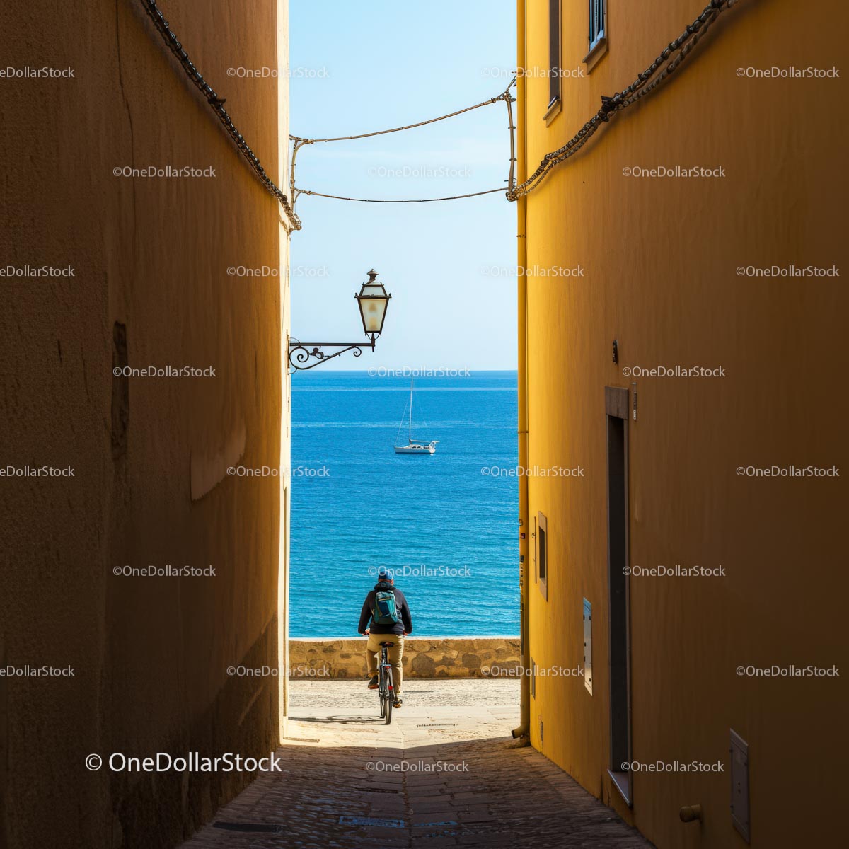 Bicyclist in a Narrow Alley Overlooking the Sea