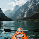Kayaker Exploring Tranquil Alpine Lake with Mountain View