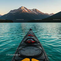 Kayaking on Mountain Lake at Sunset