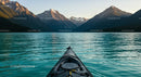 Kayak Exploring Tranquil Mountain Lake at Sunset