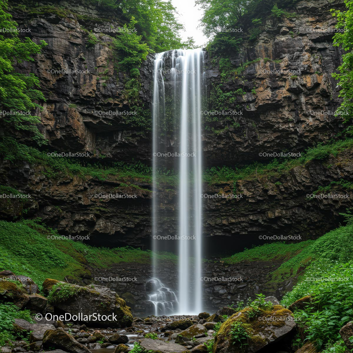 Majestic Waterfall Amidst Lush Greenery and Rocky Cliffs