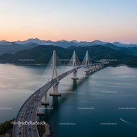 Spectacular Suspension Bridge at Sunset Over Calm Waters