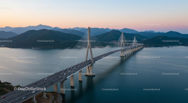 Scenic Suspension Bridge at Dusk with Mountain Backdrop