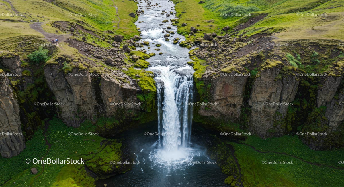 Majestic Waterfall Flowing Through Lush Landscape