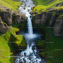 Stunning Waterfall Amidst Lush Green Cliffs
