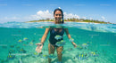 Woman Snorkeling with Colorful Fish in Tropical Waters