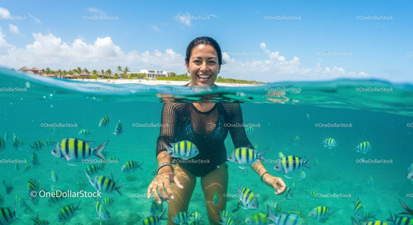Smiling Woman Snorkeling Among Vibrant Tropical Fish