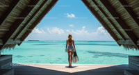 Woman Admiring Turquoise Ocean from Beach Bungalow