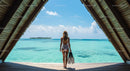 Woman with Snorkel Gear Overlooking Tropical Ocean
