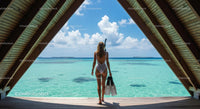 Woman Enjoying a Tropical Ocean View from Wooden Hut