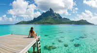 Woman Relaxing on Dock with Stunning Island View