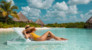 Woman Relaxing Poolside at Tropical Beach Resort